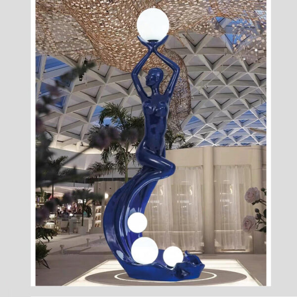 Blue female sculpture lamp with upward arms and integrated globe lighting, Model L6620