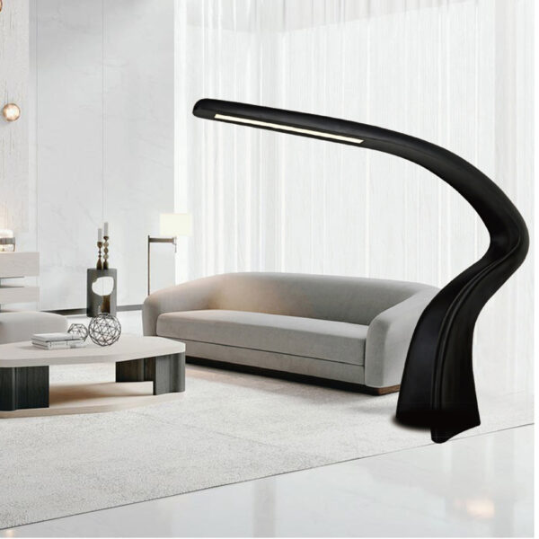 Modern black sculptural floor lamp with curved LED design, model L2056, in luxury living room.