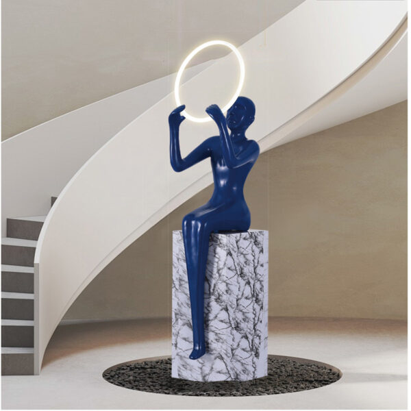 Blue seated female sculpture lamp with circular LED ring – Model L2038