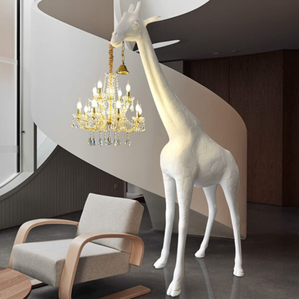 Giraffe holding chandelier floor lamp in black and white for commercial interior decoration